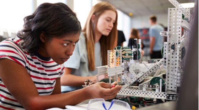 p0007221.m06873.two_female_college_students_building_machine_in_science_robotics_or_picture_id...jpg